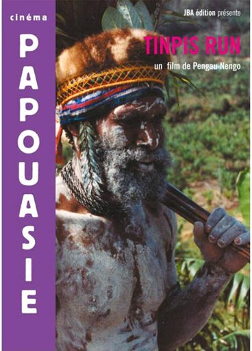 Poster for the movie "Tinpis Run", showing protagonist Papa, a Papuan highland chief with a beard, wearing traditional clothing and white ochre. French text reads, "Papuan Cinema. JBA Edition presents Tinpis Run, a movie by Pengau Nengo."